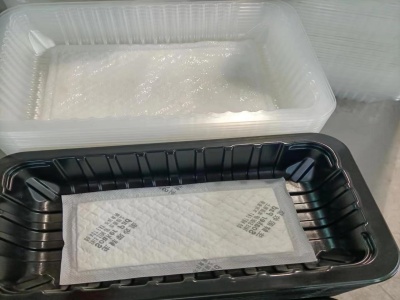 生鲜托盘吸水垫全自动落盒机